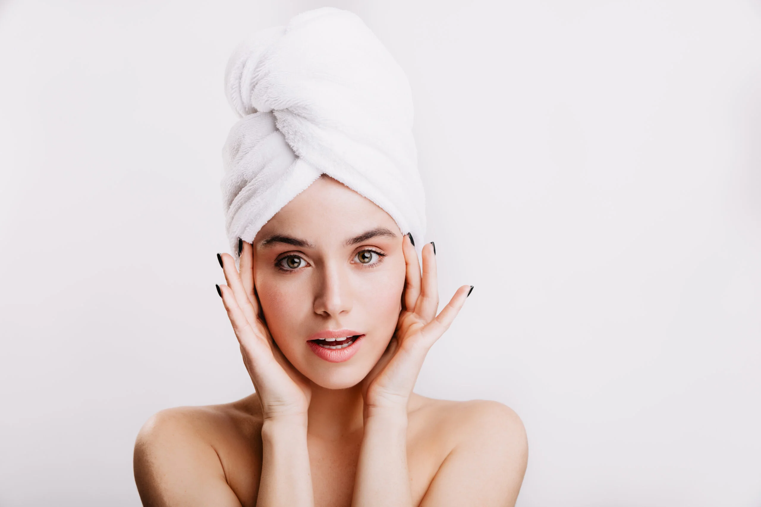 snapshot healthy beautiful girl white towel her head woman with green eyes touches her face scaled